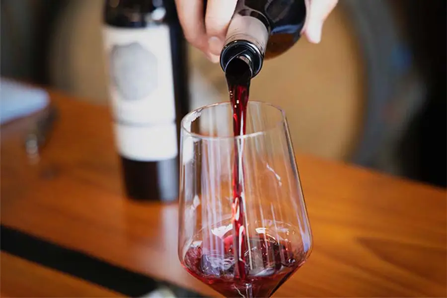 Red wine being poured into a glass